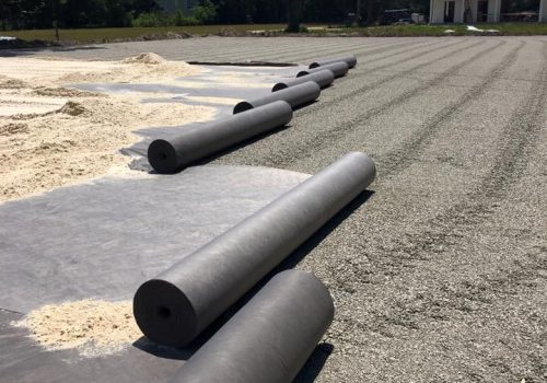 Separation layer for horse arena footing